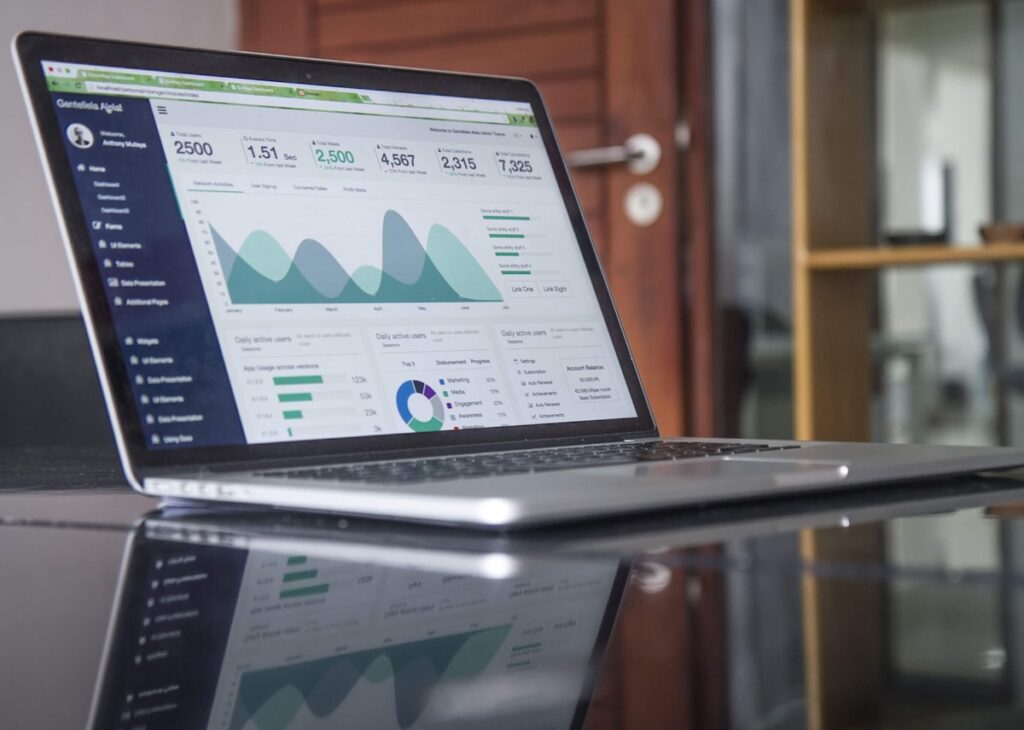 Analytics on a laptop showing page load and form completion metrics