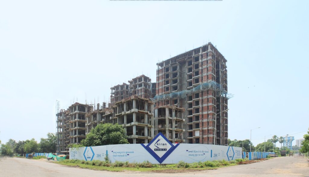 Residential building under construction with project signage, illustrating RERA advertising rules