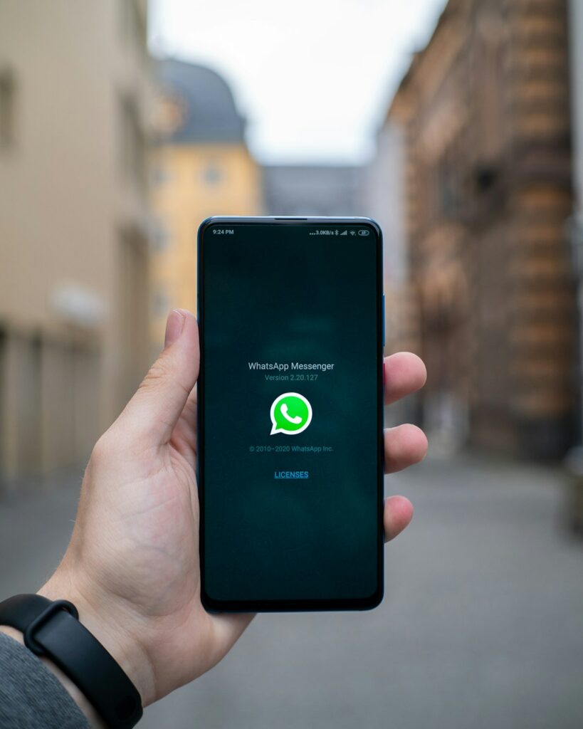 Phone showing a chat thread, the core channel for WhatsApp marketing for real estate in Punjab