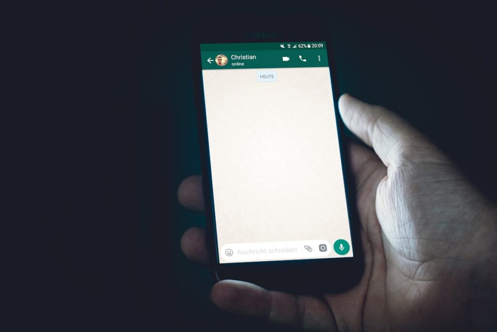 Property buyer reading a message from a builder on a smartphone