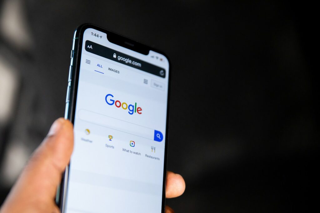 Dealer checking 99acres package price on a phone