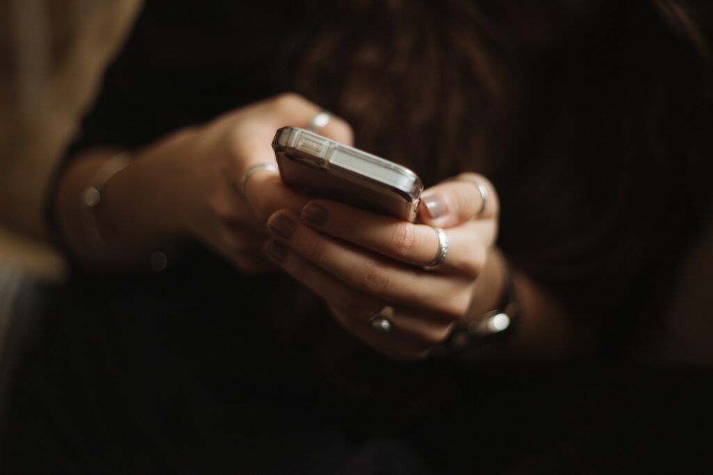 Home buyer scrolling property ads on Instagram on a smartphone