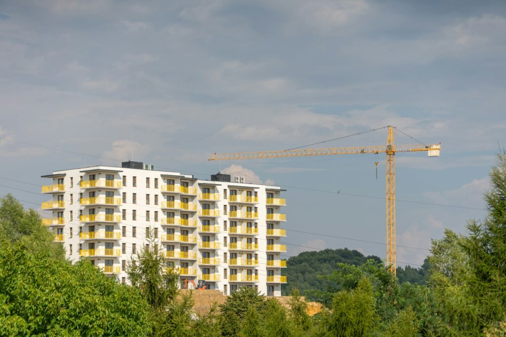 Apartment tower with crane showing construction progress for the quarterly report
