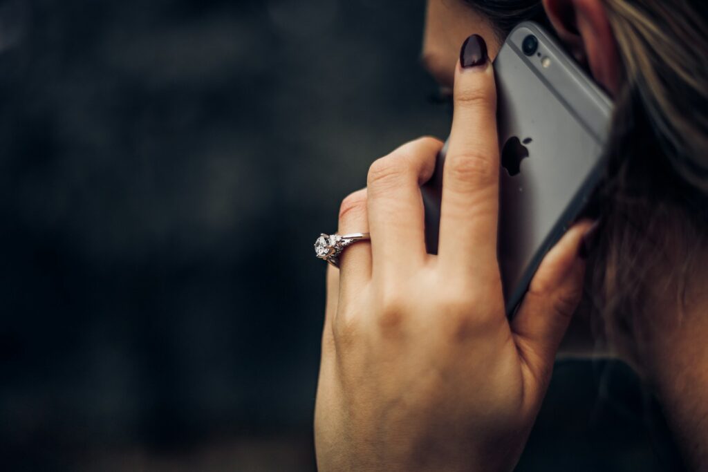 Woman answering a sales call on her mobile phone