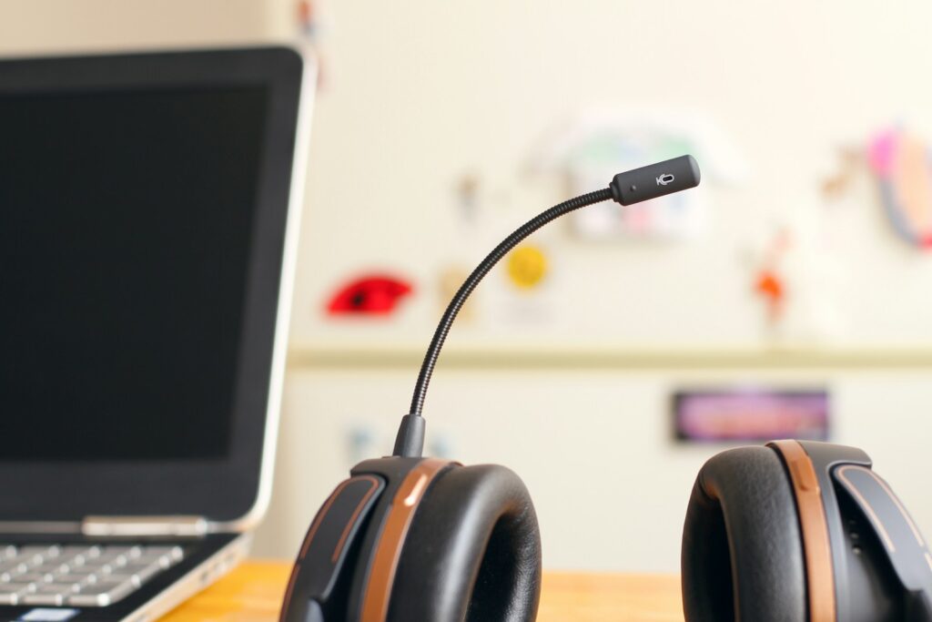 Headset beside a laptop at a property sales desk