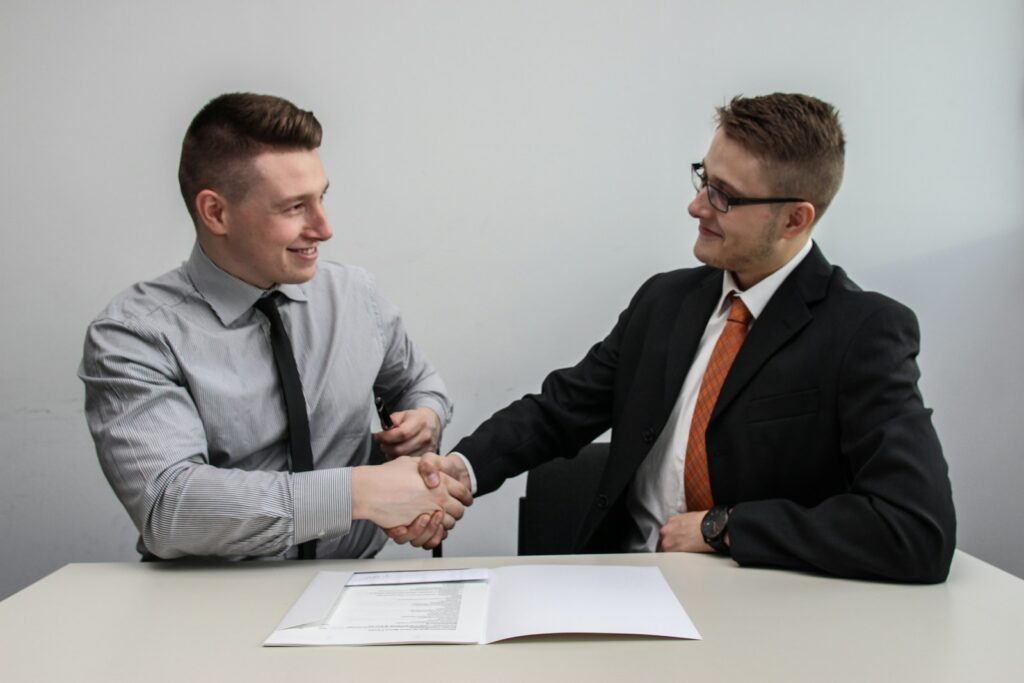 Broker and developer shaking hands after signing up as a Square Yards channel partner