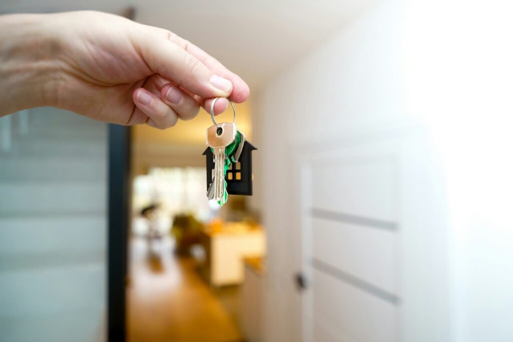Buyer receiving house keys after a deal closed through a channel partner